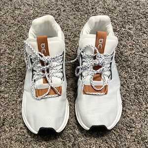 White and Brown Sneakers with Unique Lacing and Cushioned Sole
